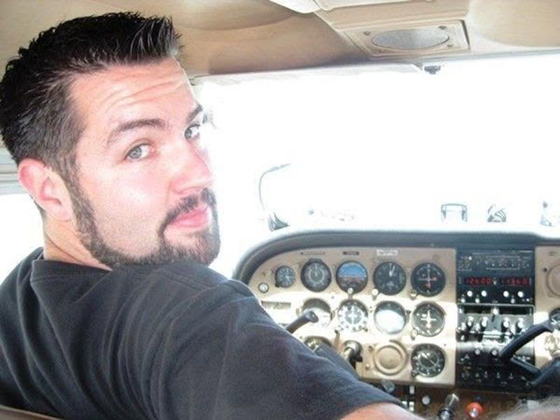 Matthew looking back from the cockpit during a Cessna training flight